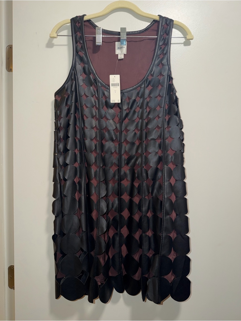 Leather-look vest with circular appliqués